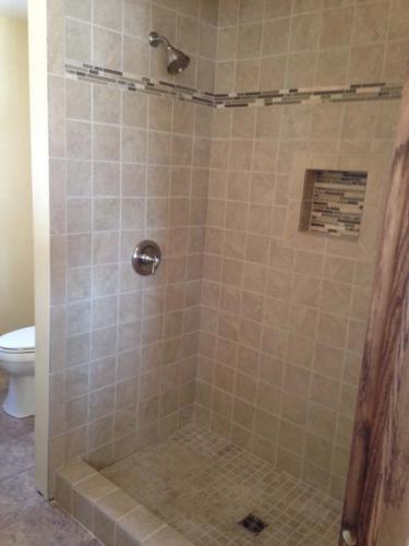 This new shower is complete and ready for use. Walk right in and enjoy your new custom bathroom!