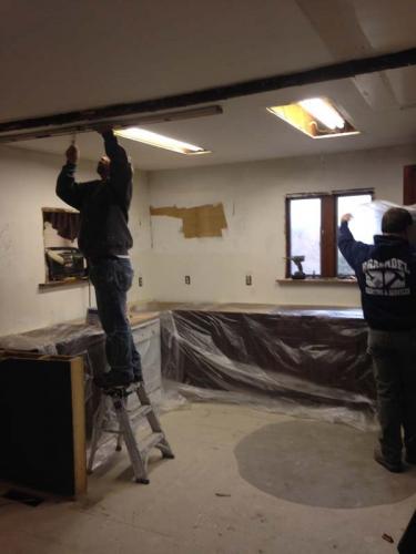 Braendel Services crew members are hard at work at the beginning of this kitchen remodeling project.