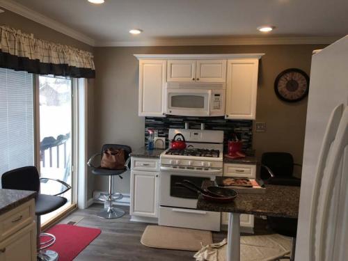 This custom kitchen is complete with a peninsula island.