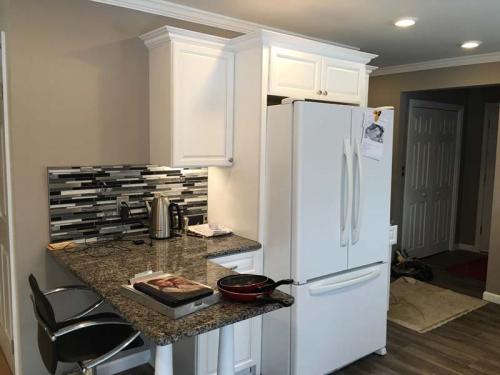 A view of a custom granite dining nook as part of this custom kitchen remodel. 