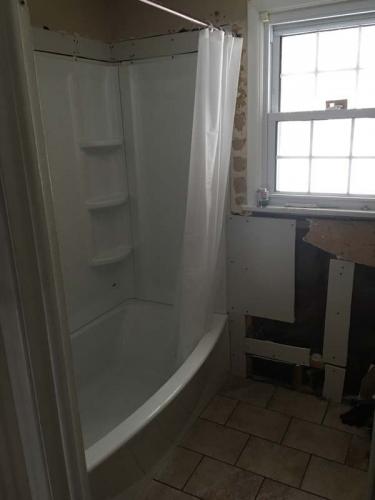 Braendel Services has installed this shower-tub and is ready to get working on the rest of this custom bathroom. 