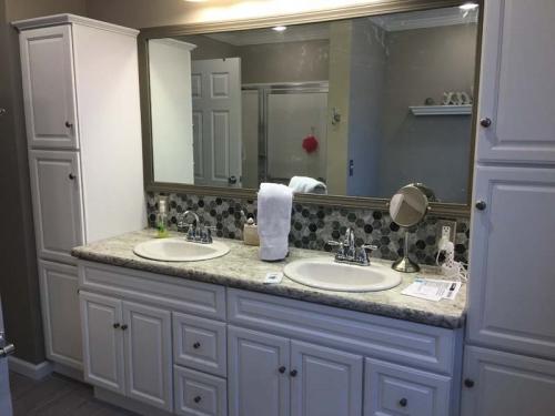 Twin sinks and plenty of storage space make this custom bathroom a favorite of homeowners in Erie, PA.