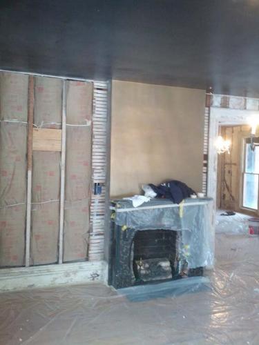 This home remodeling project by Braendel Services included a restoration of the existing fireplace. 