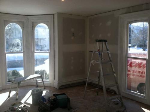 The walls in this gorgeous front room are almost ready for a paint job from the Braendel team.