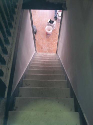 Looking down the staircase of a home being renovated by Braendel Services in Erie, PA.