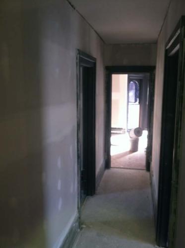 Looking down the hallway of home that is being completely remodeled by Braendel Services.