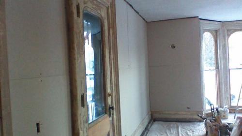 Now that the drywall of this room has been added, it is ready for paint and new floors!