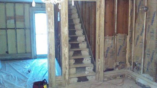 A view up the stairs of a house that is being renovated by Braendel Services.