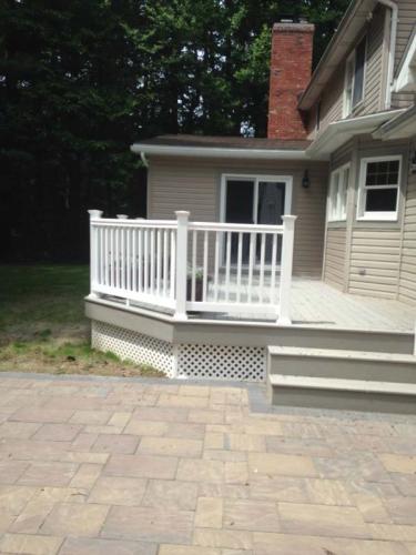 New siding (beige) by Braendel looks amazing when viewed from the side of this wrap-around porch. 