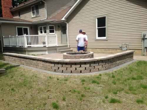 New masonry work enhances this custom-built firepit.