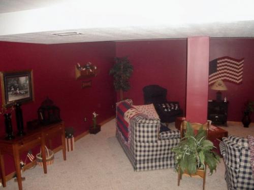This den is cozy and comfortable after a fresh deep-red paint job by Braendel Services.