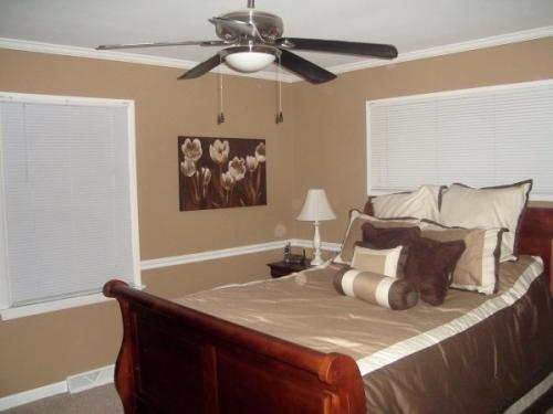 This bedroom is warm and inviting with a new paint job by Braendel. Don't you just want to fall asleep in these beige walls? 