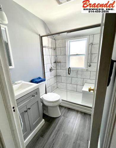 The focal point of this custom bathroom is definitely the marble shower. Check it out!