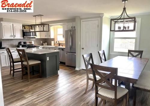 This beautiful new kitchen has custom floors, cabinets, counters, fixtures, and a fresh paint job.